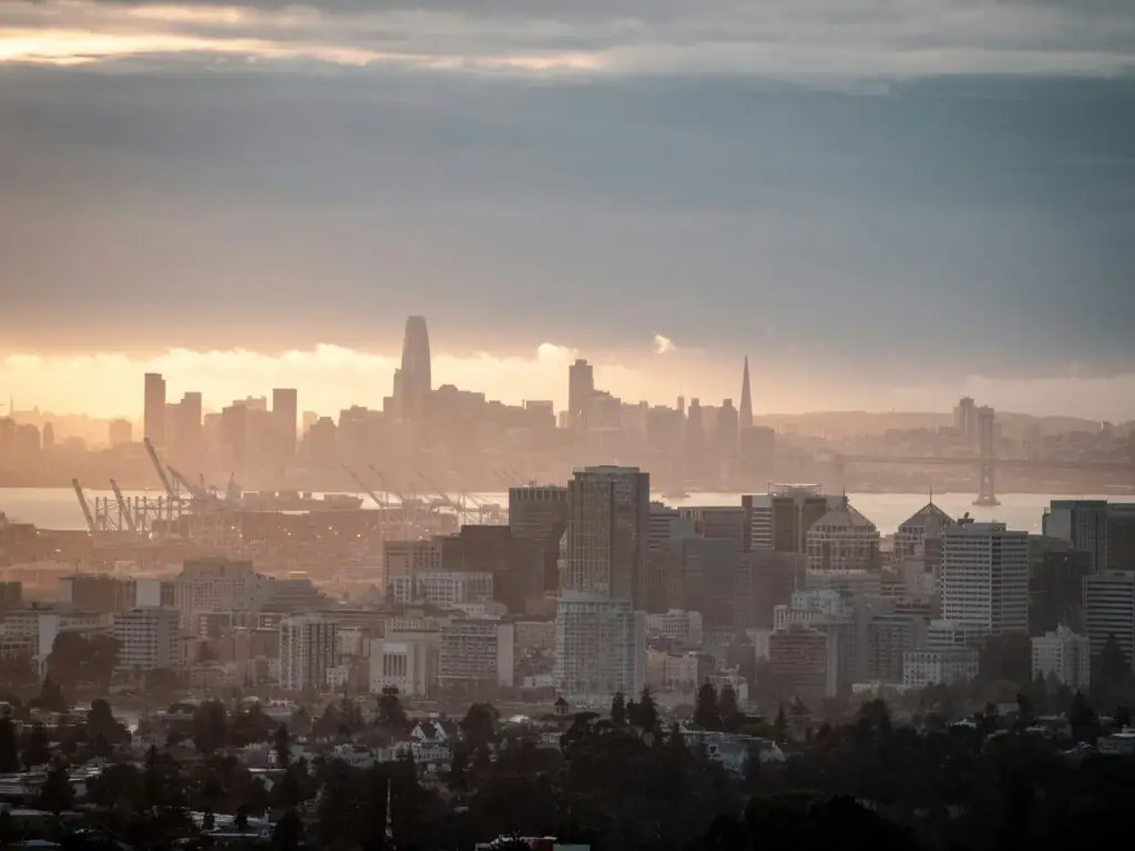 View of the east bay from the Oakland Hills with San Francisco in the background at sunset